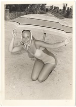 Cathie Alexander with a scarf and under a umbrella