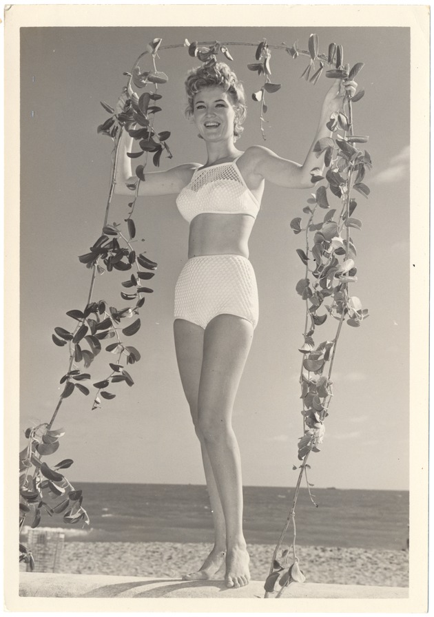 Karla Scurto holding a long vine - 