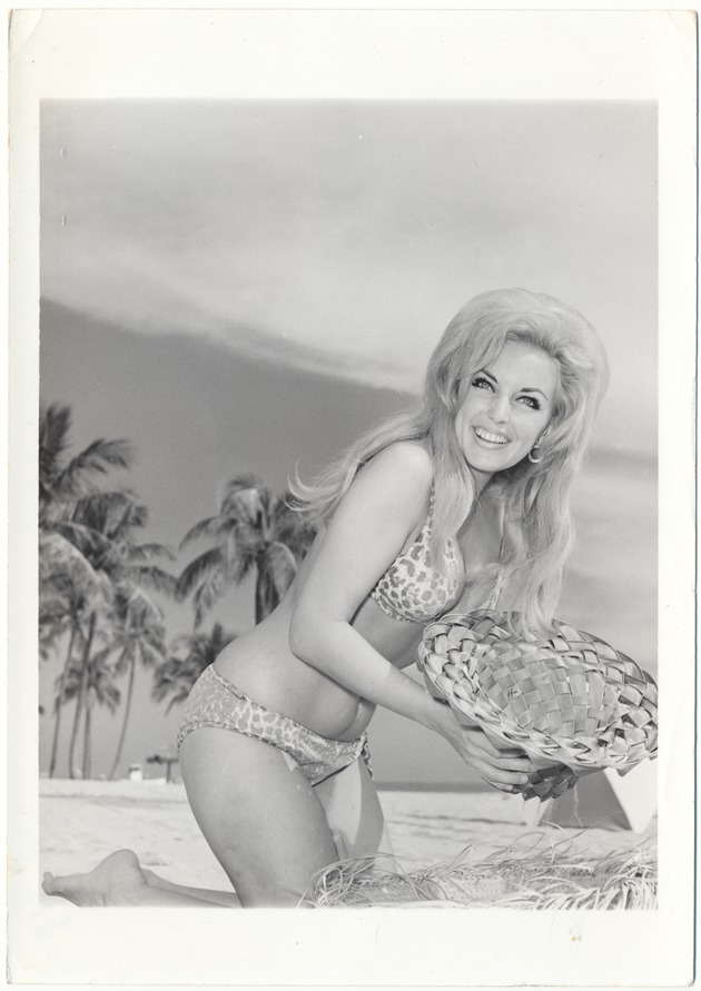 Dawn Wilding holding a hat - 