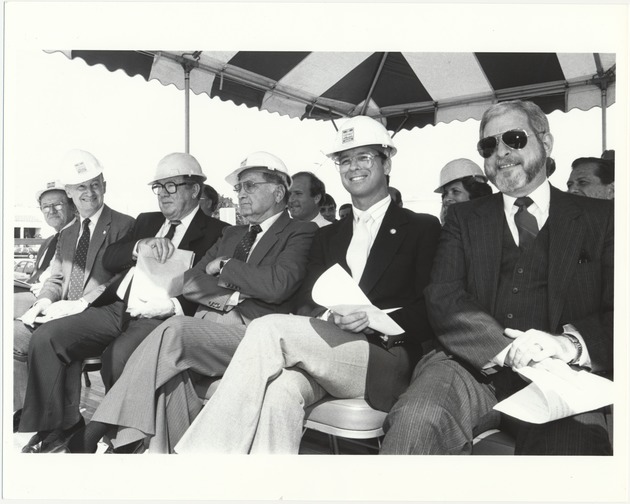 Miami Beach officials at city events, 1985 - Photograph, recto: [(Left to right) Commissioners Sidney Weisburd, Abe Resnick, ?, ?, Bruce Singer, and City Manager Rob Parkins during a ground breaking ceremony, ca. 1985]
