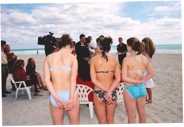 Valentine's Day beach wedding officiated by Mayor David Dermer - Photograph, recto: [View of Mayor David Dermer during a beach wedding. Bridemaids Elizabeth Stadlander, Jose Bermudez, Pauline Walters, and Francis Rodriguez wearing bikinis]