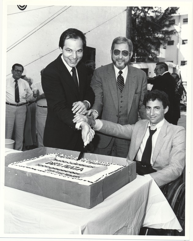 Miami Beach City Manager Rob Parkins and other officials at various events - Photograph, recto: [Rehab/remodeling ceremony for Deco Plaza (711 Fifth Street). (Left to right) Neil Berman, City Manager Rob Parkins, and Martin Ergas. March 26, 1984]