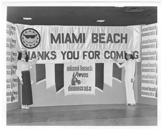 Democratic National Convention Ephemera, 1972 - Photograph, recto: [Welcome sign titled "Miami Beach Thank You For Coming miami beach I(heart)oves democrats."