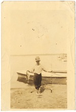 Young boy holding fish