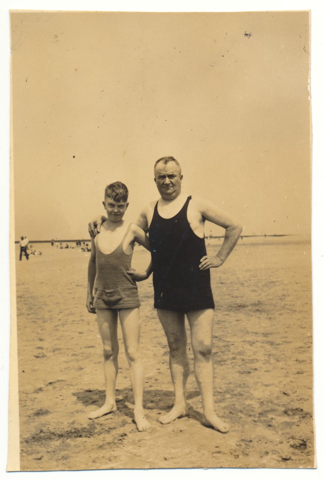 Man and boy posing at the beach - 