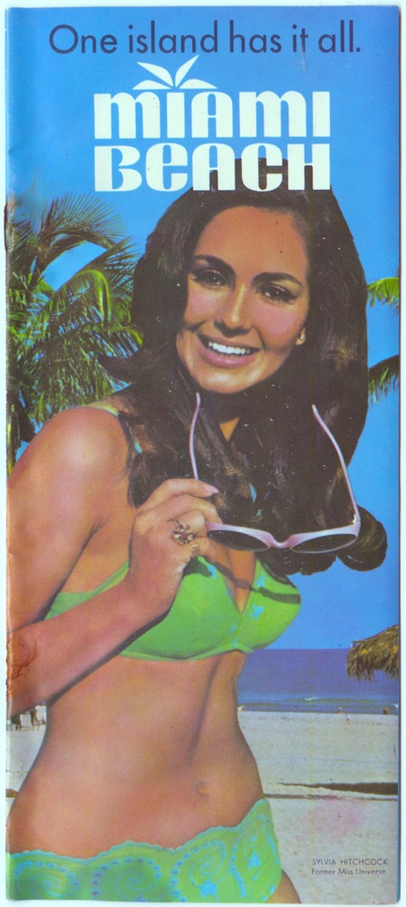 Miami Beach: one island has it all - Pamphlet, cover: One island has it all. Miami Beach [Posed photograph of Sylvia Hitchcock, former Miss Universe]