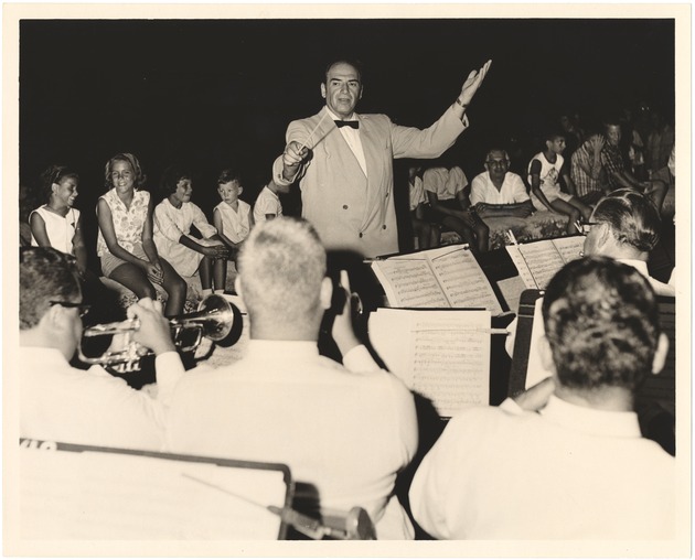 Conductor at night concert - Recto