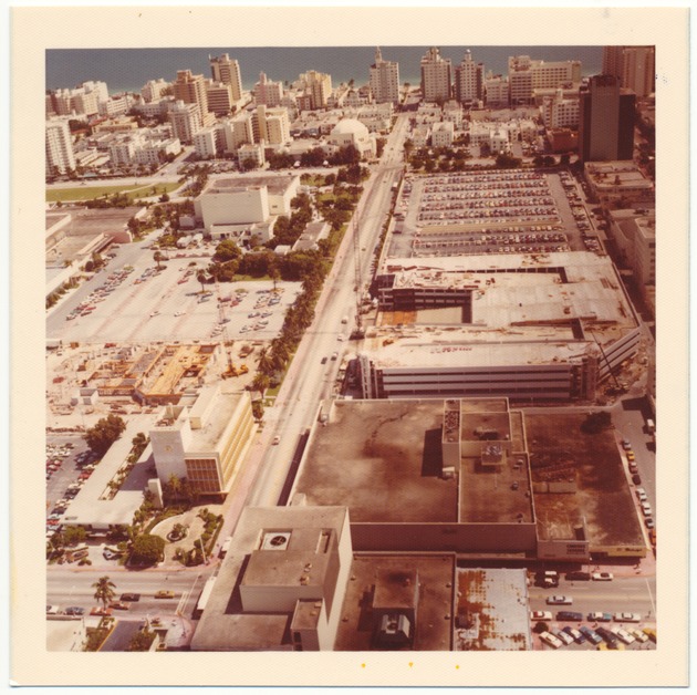Aerial views of Miami Beach and City of Miami Beach City Hall 1970-1980 - Photograph, recto: [Aerial view of 17th Street and the Fillmore facing east]