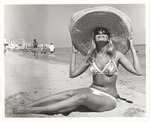 Swimsuit model in various poses on the beach