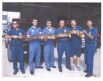 Miami Beach Firefighters holding large captured snake