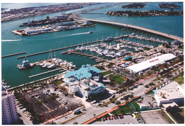 South Beach, Government Cut, Miami Beach Marina, MacArthur Causeway and Islands, early 2000s - Photograph, recto: [Aerial view of the Miami Beach Marina, Monty's Restaurant, the McArthur Causeway, the US Coast Guard Island, Terminal Island, Port of Miami, Hibiscus Island, Star Island and Palm Island looking west] 
