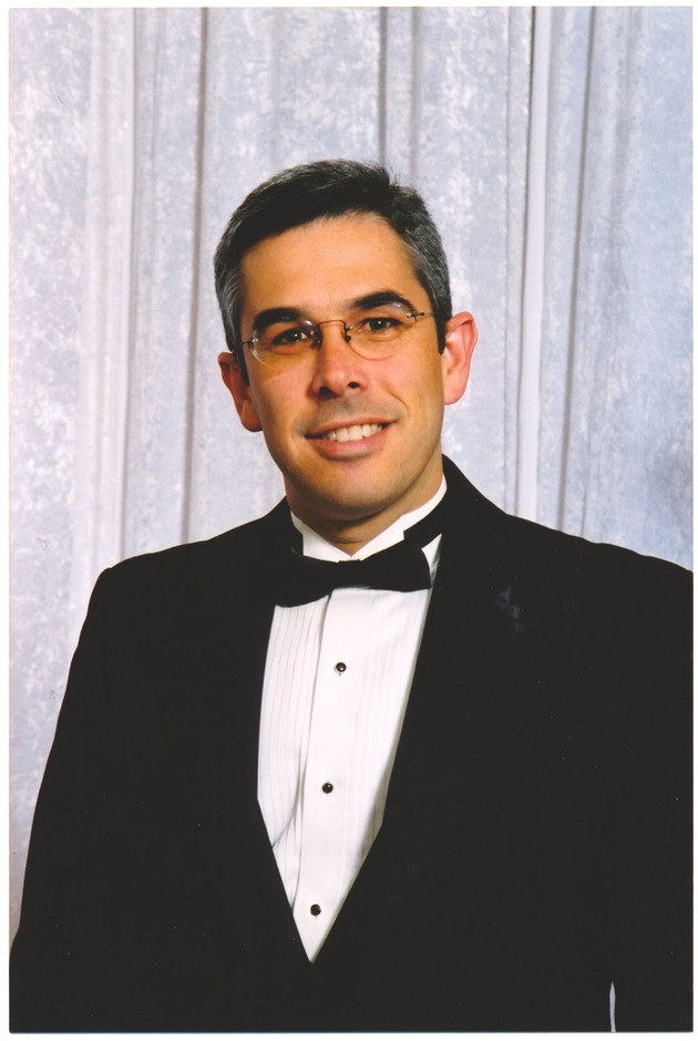 Miami Beach City Manager Jorge M. Gonzalez - Photograph, recto: [Portrait of City Manager Jorge M. Gonzalez at a black tie gala dinner at the Miami Beach Chamber of Commerce, 2003].