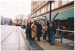 Members of the Miami Beach City Commission waiting at a tram stop in San Francisco