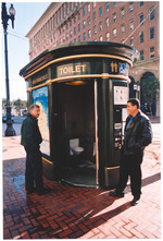 Members of the Miami Beach City Commission in front of public bathroom in San Francisco