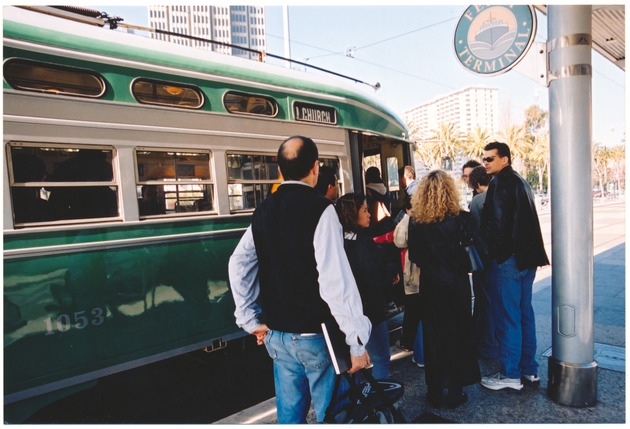 People getting on to a tram, San Francisco, California - 