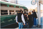 People getting on to a tram, San Francisco, California
