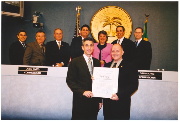 Neil Fritz accepting certificate for acting As Executive Director For North Beach Development Corporation