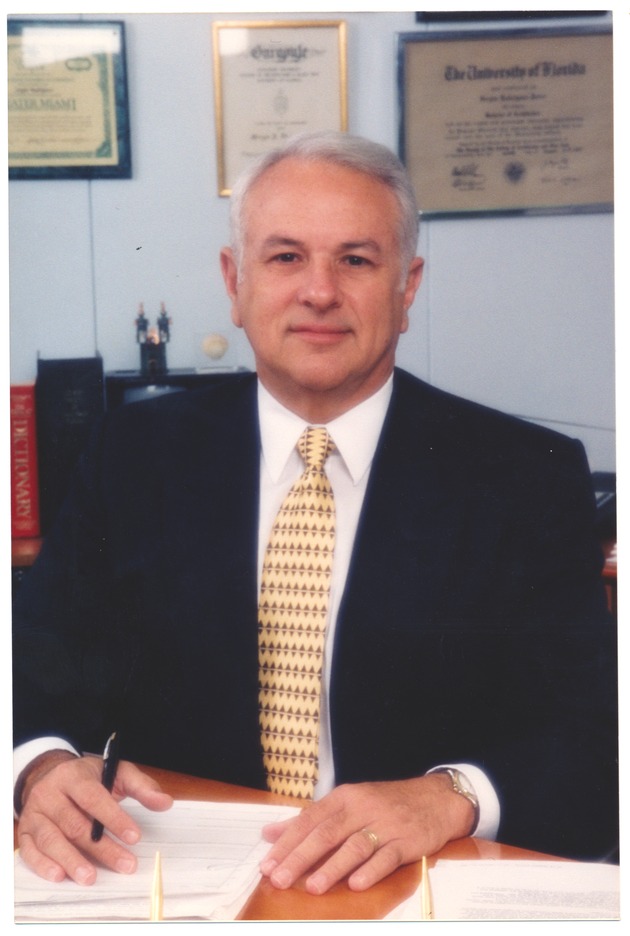 Sergio Rodriguez, Interim City Manager, Sitting at his Desk
