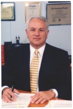 Sergio Rodriguez, Interim City Manager, Sitting at his Desk