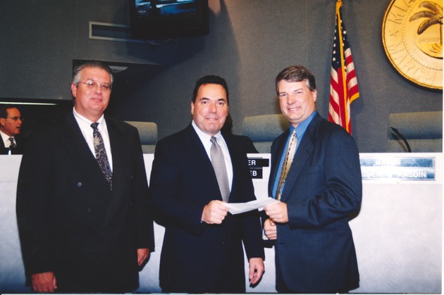 Mayor Kasdin, Doug tobern and Unidentified Individual Accepting Check - 