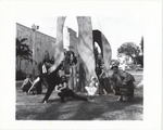 Artists around structure next to The Bass Museum