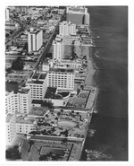 Aerial views of oceanfront buildings showing parks and beach erosion between Fisher Island and Halouver Pass, 1969