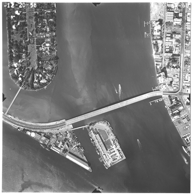 Aerial views of Miami Beach, December 1958 - Photograph, recto: [Aerial view of the southern part of Star Island when it connects to the MacArthur Causeway and Terminal Island through Bridge Road]