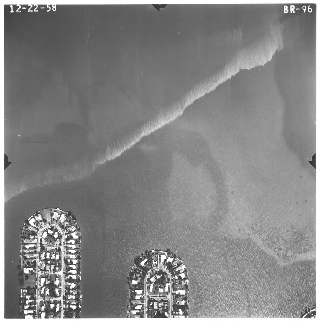 Aerial view of man-made islands in Biscayne Bay, Florida - Photograph, recto: [Aerial view of one of the Venetian Islands and the Rivo Alto Island on Biscayne Bay]