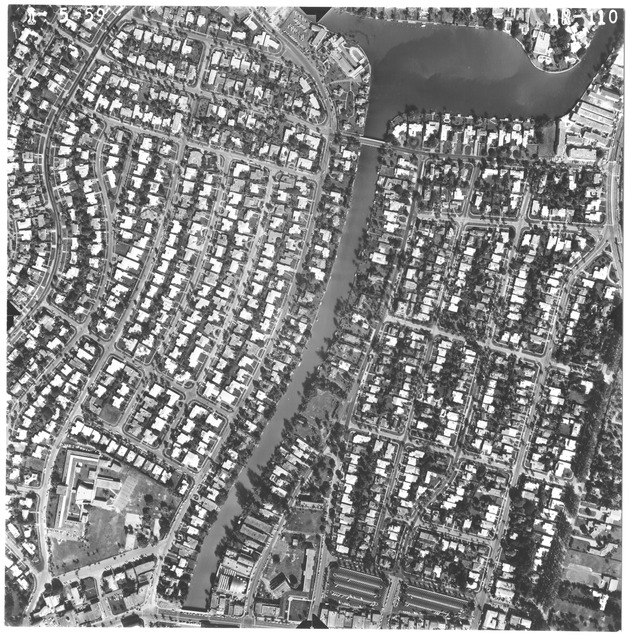 Aerial view of Miami Beach between Normandy Isle and 18th Street - Photograph, recto: [Aerial view of Surprise Lake and Biscayne Waterway]