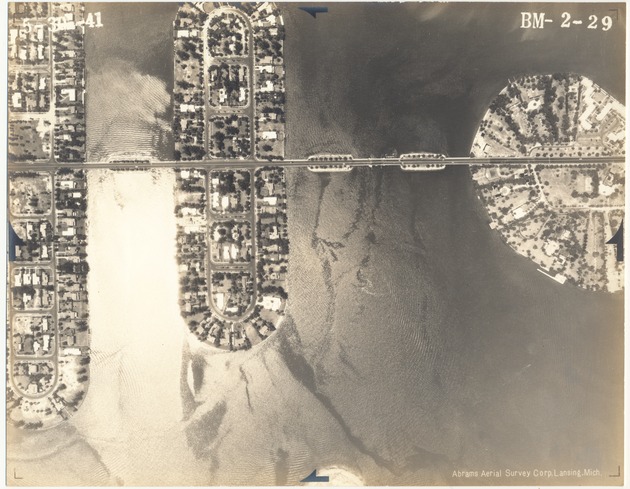 Aerial view of man-made islands and causeways, 1941 - Photograph, recto: [Aerial view of the Di Lido, Rivo Alto and Belle Islands]