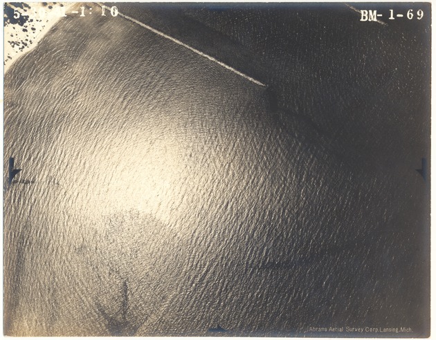 Aerial view of Miami Beach oceanfront buildings and bay side islands, 1941 - Photograph, recto: [Aerial view of ocean at an unidentified location]
