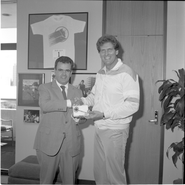 Alex Daoud, Carlos De La Cruz, Greg Ray, Mike Bassichis, and Carlos Fernandez Shaw - Negative: [View of Alex Daoud presenting key to Carlos De La Cruz ]