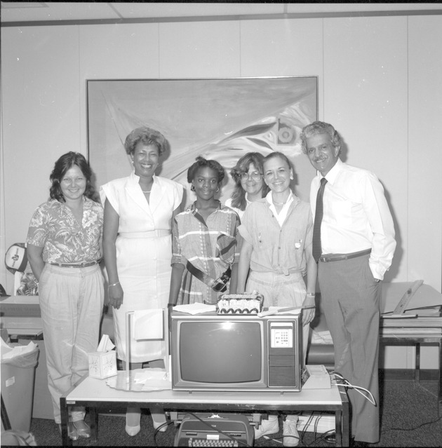 Miami Beach City workers and Certificate of Appreciation to Anthony Jones - Negative: [View of city workers around a television]