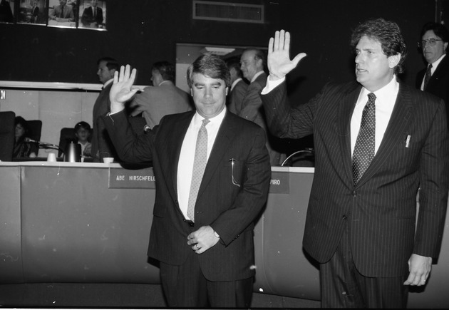 Miami Beach City officials and employees during various events and presentation of awards, 1990s - Negative: [Mayor Alex Daoud and unidentified individual swearing oath]
