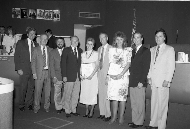 Miami Beach City officials and Mayor Alex Daoud, Representative Claude Pepper at various events, 1980s - Negative: [View of Commissioners presenting awards inside the Commission Chambers]