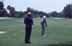 Men playing on Miami Beach golf course, 1982