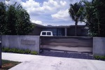 Residence with a stainless steel sliding gate
