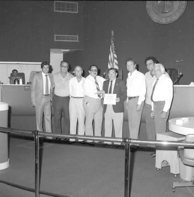 Harry Mildner award presentation, Miami Beach bus bench dedication - Negative: [View of Commission meeting scene]