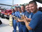 Firefighters pose with snake