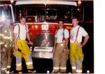 Firefighters in suspenders with E-2 Fire Truck