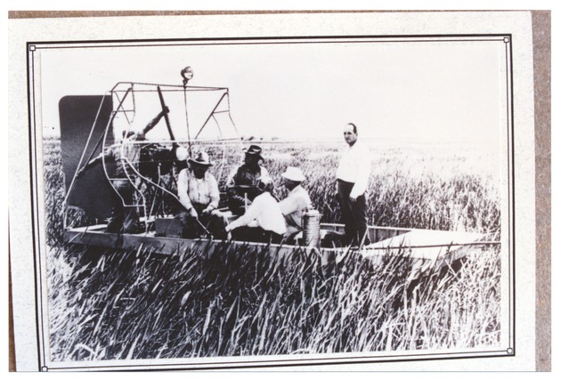 Men in an airboat - Recto Photograph