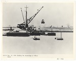 Crane building the drawbridge at Allison Island