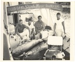 [1950] Four men on a fishing boat with their catch