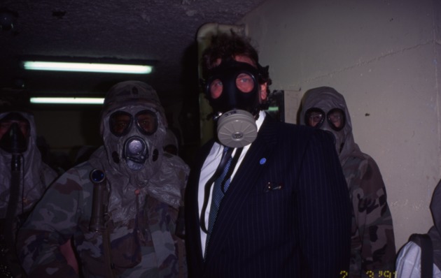 Mayor Daoud and others in gas masks - Image 1