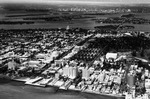 Aerial view of Miami Beach looking east. The National Hotel in the front. The Flamingo Hotel, the Venetian Causeway, the County Causeway and Miami's skyline in the back.