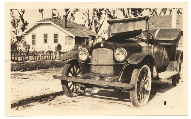 Hupmobile Touring located by a residence on 542 Euclid Ave. - Recto Photograph