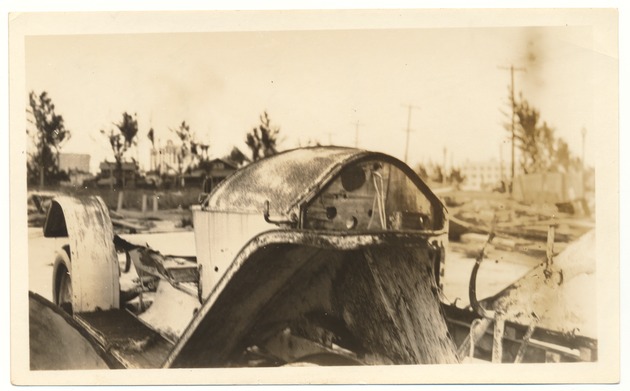 Old car owned by Carl G. Fisher located north of Gulf Refining Co. - Recto Photograph