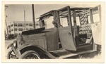 [1927-04-06] Chevrolet Sedan located in the rear of the Mare Grande Hotel, 6th and Ocean Drive