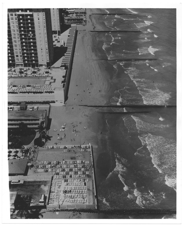 View of hotels on ocean front during high tide - Recto Photograph