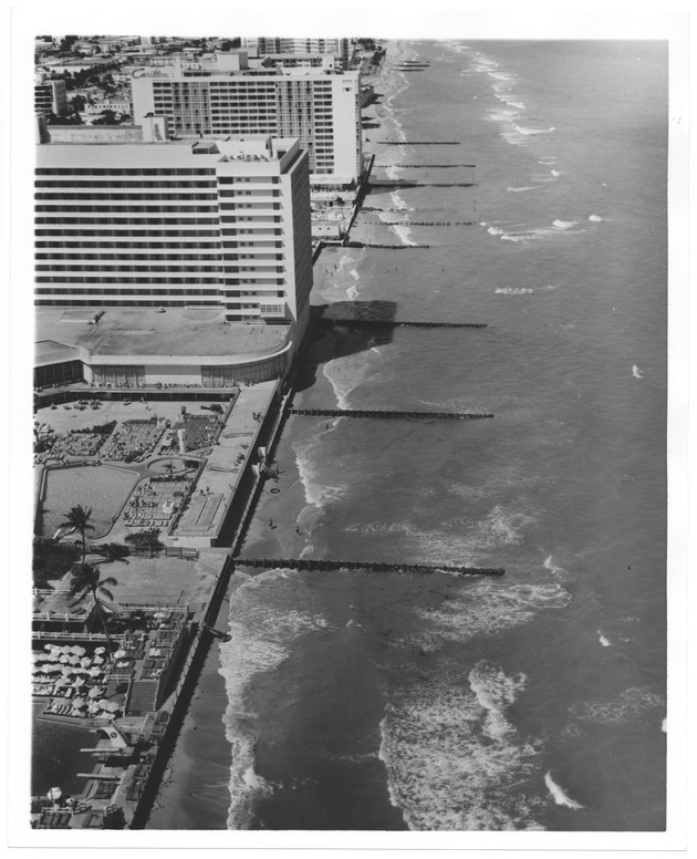 Aerial views of hotels on the ocean front during high tide - Recto Photograph